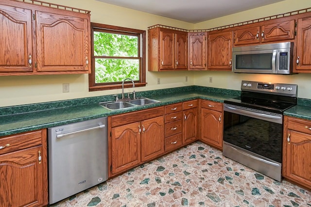 kitchen featuring stainless steel appliances and sink