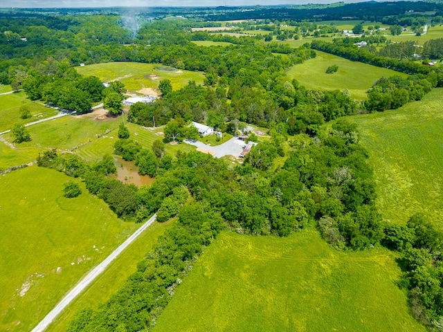 birds eye view of property with a rural view