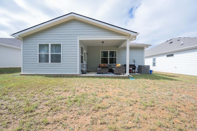 back of house with an outdoor living space, central AC, a lawn, and a patio