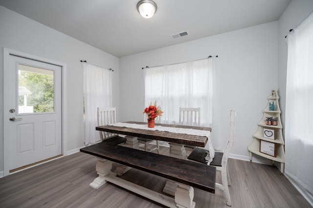 dining space featuring hardwood / wood-style flooring