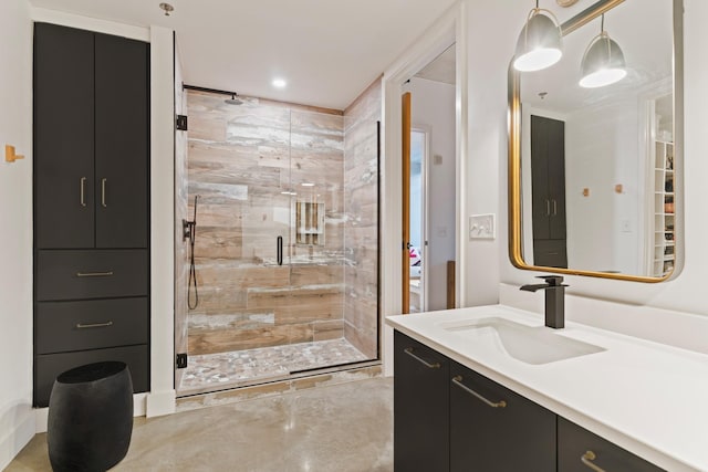 bathroom featuring vanity and an enclosed shower