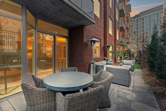 patio terrace at dusk with an outdoor hangout area