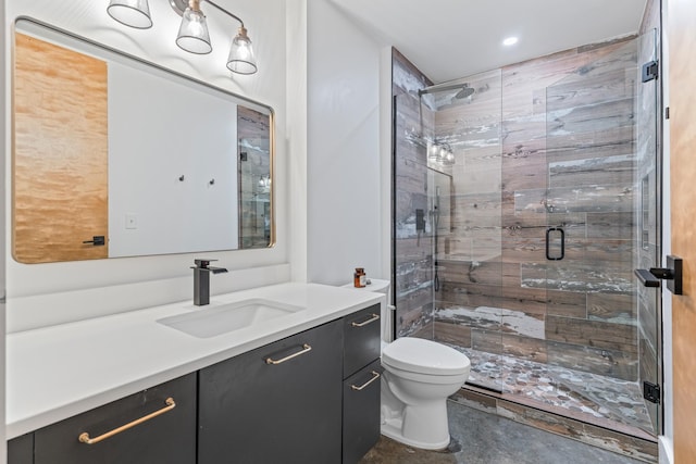 bathroom featuring vanity, toilet, and walk in shower