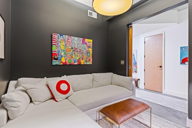 living room featuring concrete floors