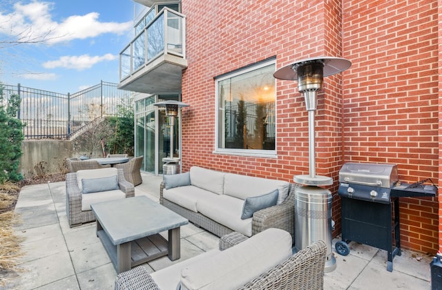 view of patio featuring area for grilling and an outdoor living space