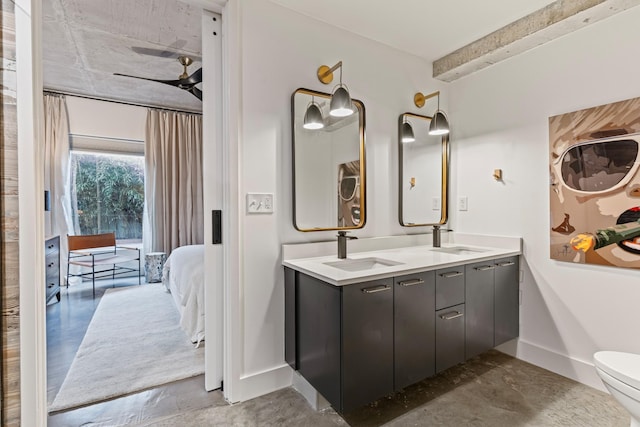 bathroom featuring vanity, ceiling fan, and toilet