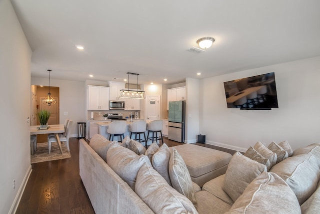 living room with dark hardwood / wood-style floors