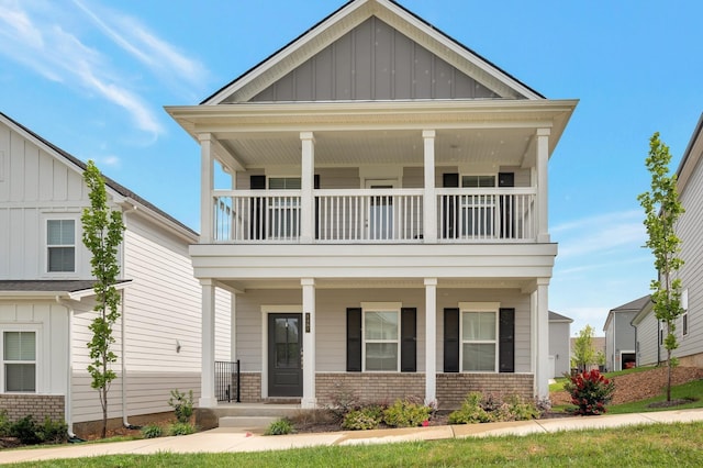 view of front facade featuring a balcony and covered porch