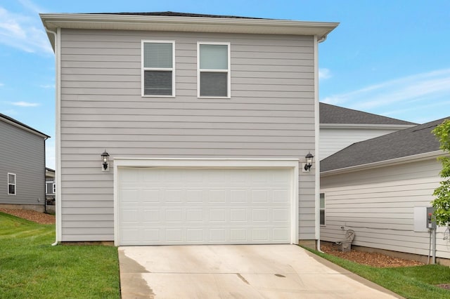 exterior space with a garage and a front yard