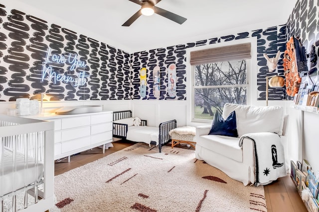 bedroom with ceiling fan and hardwood / wood-style floors