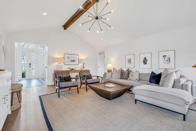 living room featuring a notable chandelier, beam ceiling, light hardwood / wood-style floors, and high vaulted ceiling