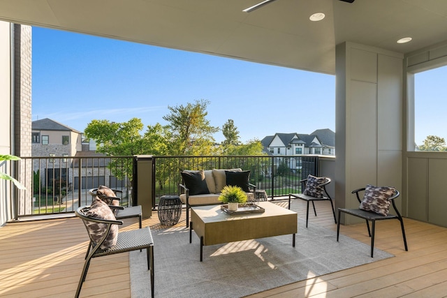 wooden terrace featuring an outdoor hangout area and ceiling fan