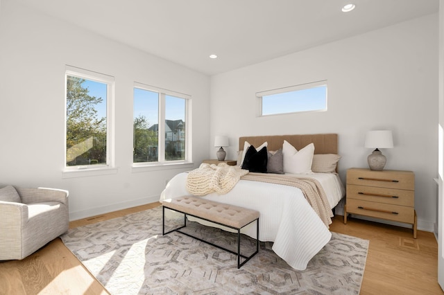 bedroom with light wood-type flooring