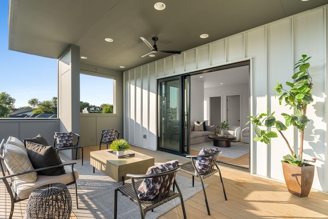 deck with ceiling fan and outdoor lounge area