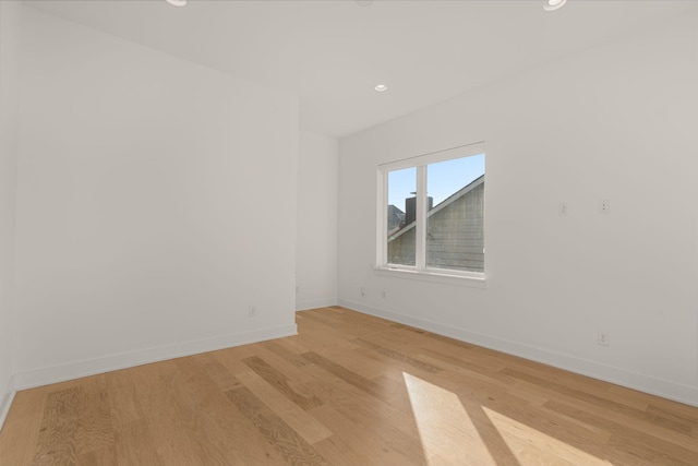 unfurnished room featuring light hardwood / wood-style floors