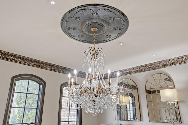 interior details featuring a chandelier