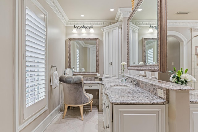 bathroom featuring vanity and ornamental molding