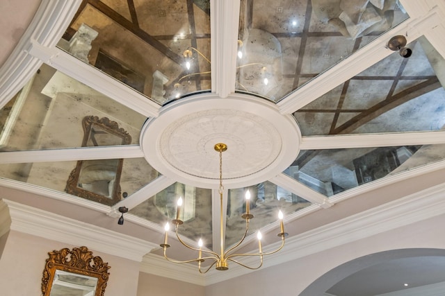 details with crown molding and a notable chandelier