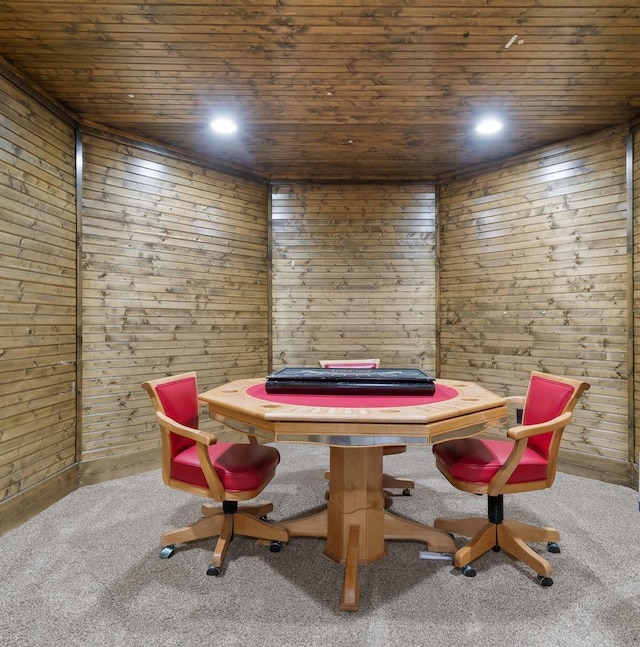 rec room with carpet floors, wooden ceiling, and wood walls