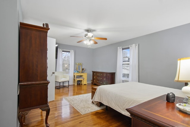 bedroom featuring hardwood / wood-style flooring and ceiling fan