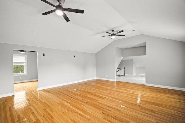 interior space with lofted ceiling and light wood-type flooring