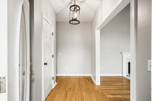 hall with light hardwood / wood-style flooring