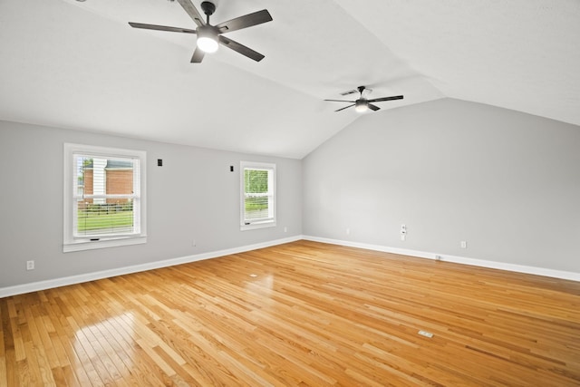 spare room with vaulted ceiling, light hardwood / wood-style floors, and ceiling fan