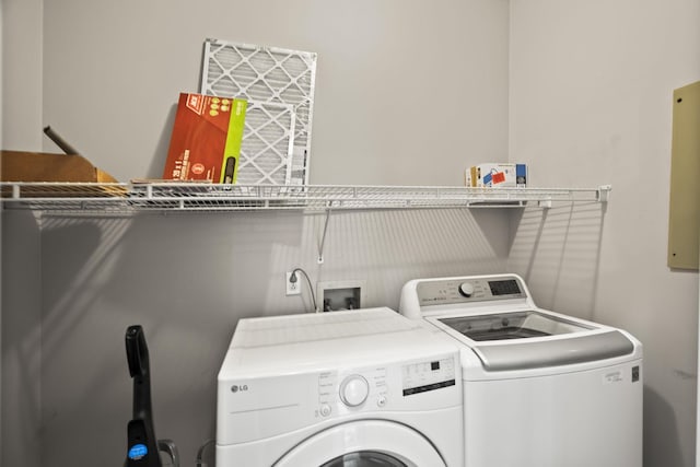 clothes washing area featuring washing machine and clothes dryer