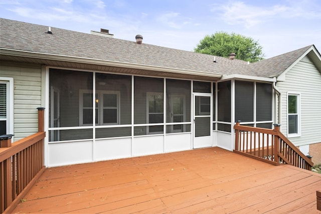 deck with a sunroom