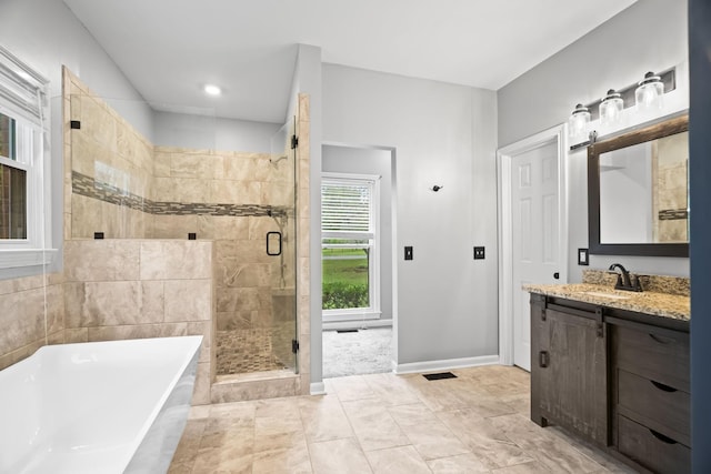 bathroom featuring vanity and plus walk in shower