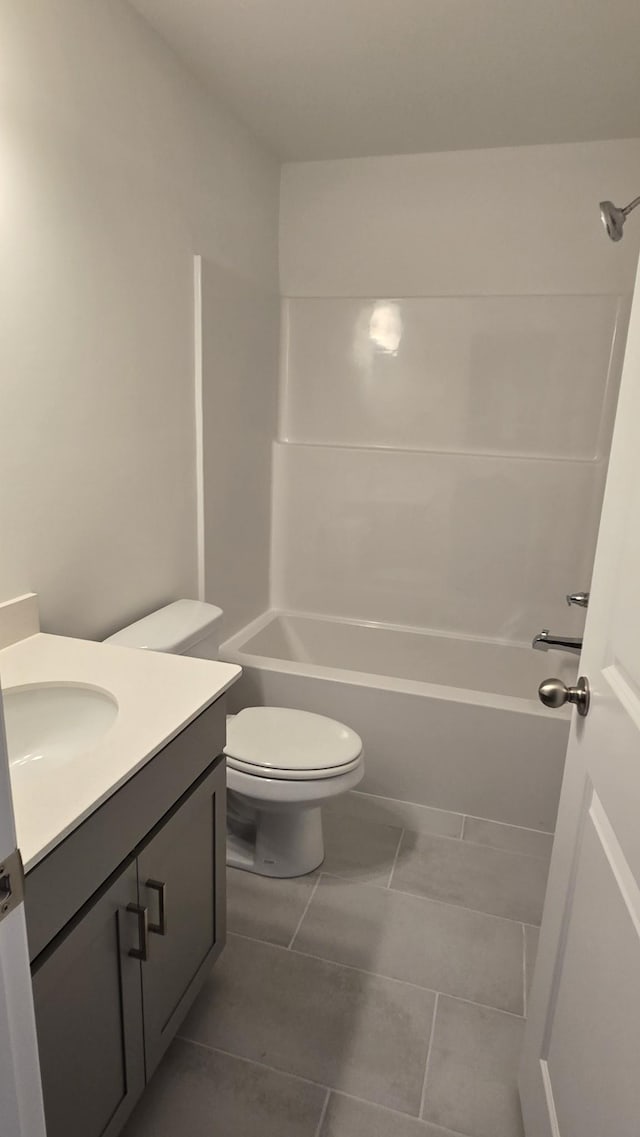 full bathroom with vanity, tile patterned floors, bathing tub / shower combination, and toilet