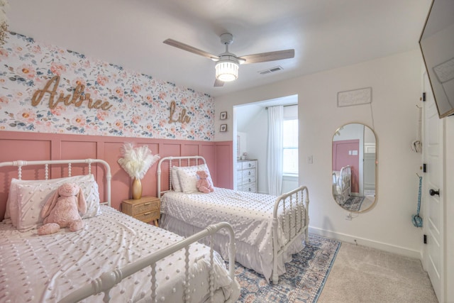 bedroom featuring light colored carpet and ceiling fan