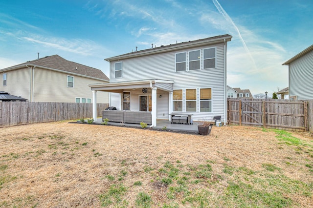 rear view of property with an outdoor hangout area, a lawn, and a patio area