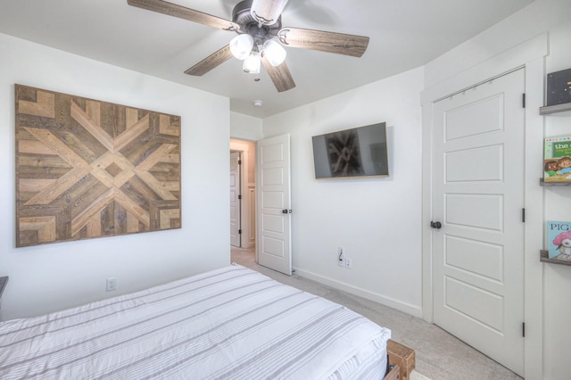 carpeted bedroom with ceiling fan