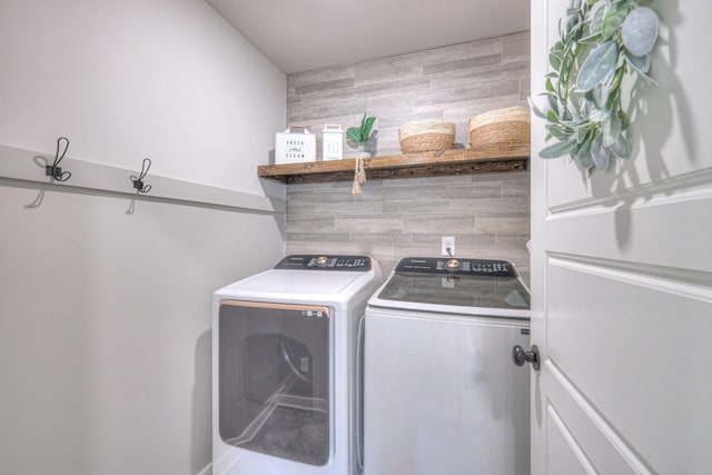 laundry area with separate washer and dryer