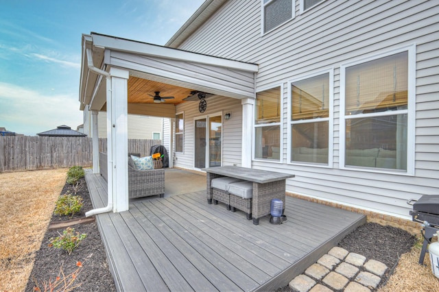 wooden deck featuring ceiling fan