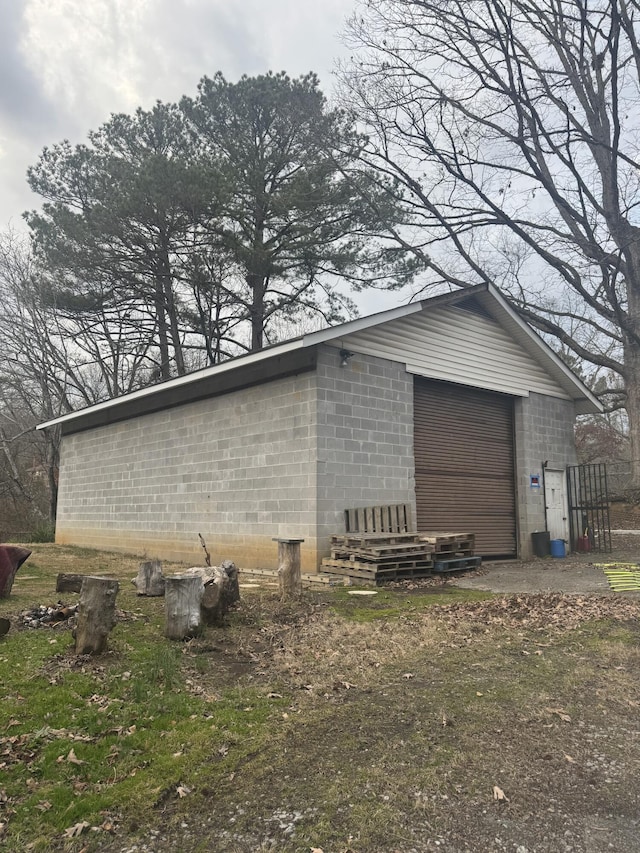 view of home's exterior featuring an outbuilding and a garage