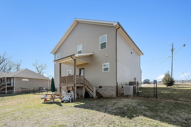 back of house with a lawn