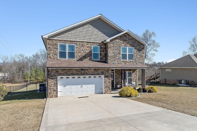 view of front of home featuring a garage, central air condition unit, and a front lawn