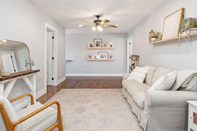 living room featuring ceiling fan and light wood-type flooring