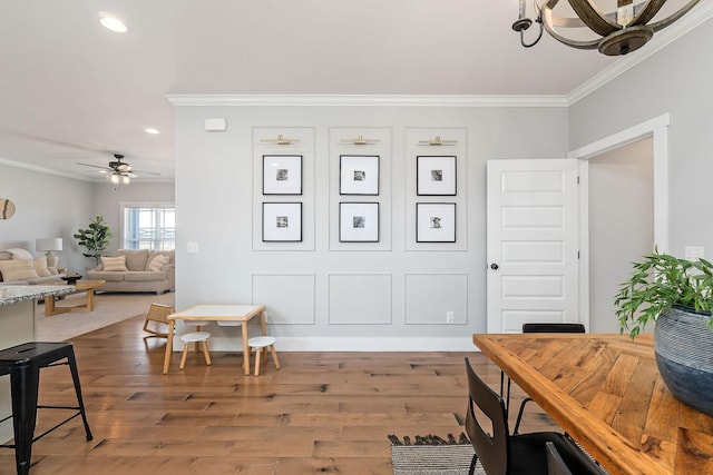 office space featuring crown molding, wood-type flooring, and ceiling fan