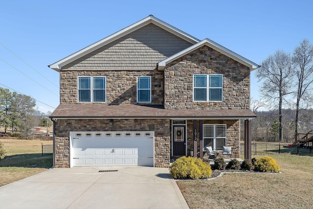 view of front of property featuring a garage, a front lawn, and a porch