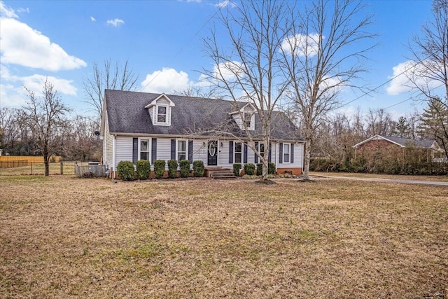 cape cod-style house featuring a front yard