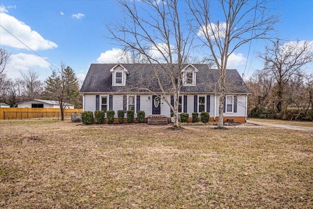 new england style home with a front lawn