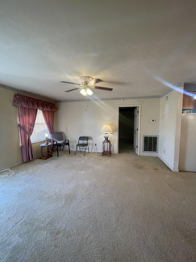 unfurnished room with carpet floors and ceiling fan