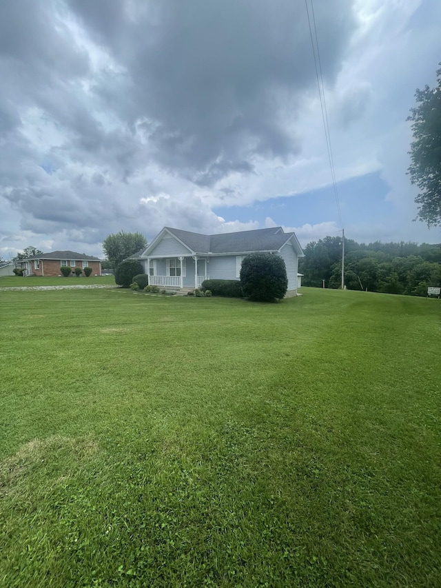 exterior space with a yard and a porch