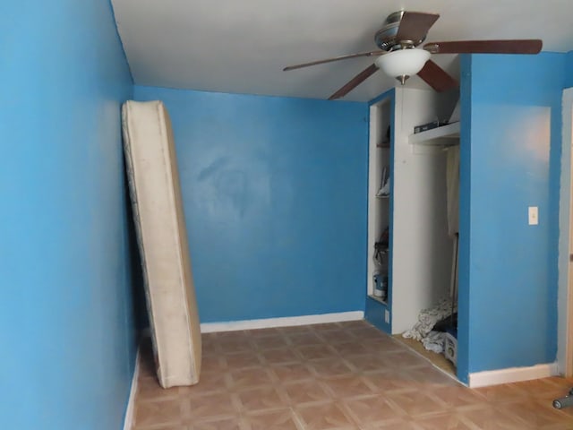 unfurnished bedroom featuring light parquet flooring and ceiling fan