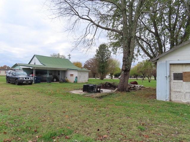 view of yard featuring a carport