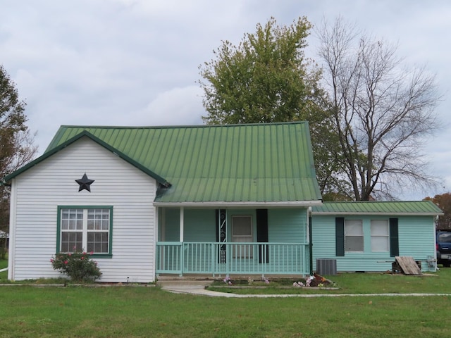 view of front of house with cooling unit, a front yard, and a porch