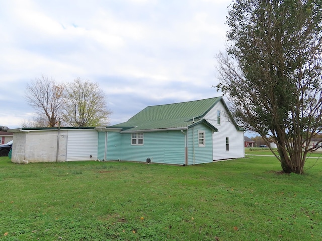 back of property with a yard